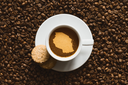 Still life photography of hot coffee beverage with map of Tanzaniaの写真素材