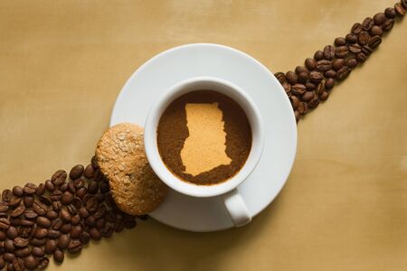 Still life photography of hot coffee beverage with map of Ghanaの写真素材