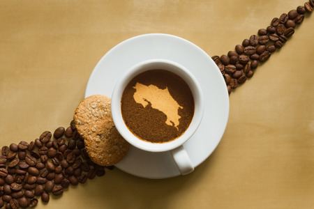 Still life photography of hot coffee beverage with map of Costa Ricaの写真素材