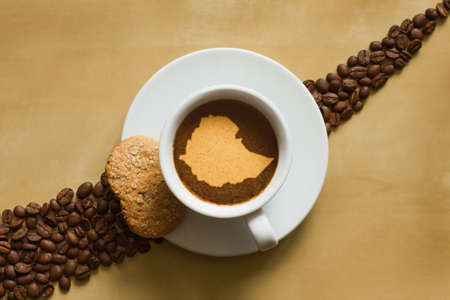Still life photography of hot coffee beverage with map of Ethiopiaの写真素材