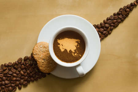 Still life photography of hot coffee beverage with map of Asia continentの写真素材