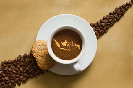 Still life photography of hot coffee beverage with map of Indonesiaの写真素材