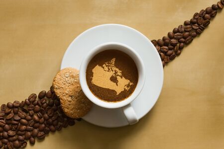 Still life photography of hot coffee beverage with map of Canadaの写真素材