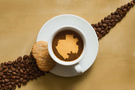 Still life photography of hot coffee beverage with map of Gabonの写真素材