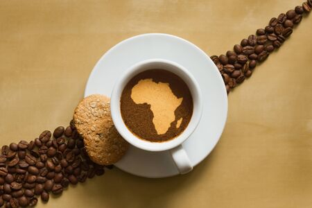 Still life photography of hot coffee beverage with map of Africaの写真素材