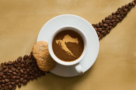 Still life photography of hot coffee beverage with map of Croatiaの写真素材