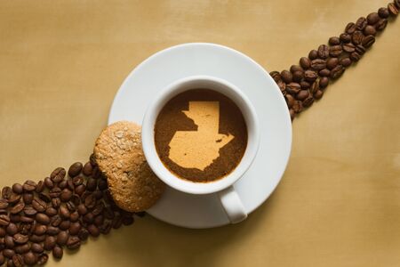 Still life photography of hot coffee beverage with map of Guatemalaの写真素材
