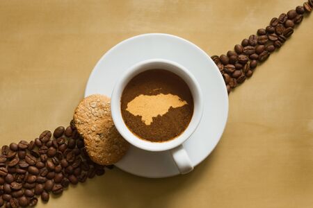 Still life photography of hot coffee beverage with map of Hondurasの写真素材