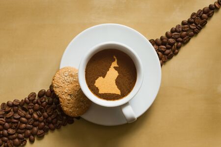Still life photography of hot coffee beverage with map of Cameroonの写真素材