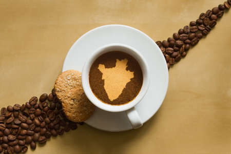 Still life photography of hot coffee beverage with map of Burundiの写真素材