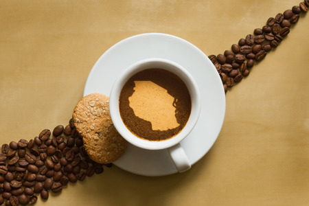 Still life photography of hot coffee beverage with map of Tanzaniaの写真素材