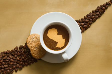 Still life photography of hot coffee beverage with map of Paraguayの写真素材