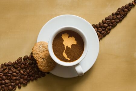 Still life photography of hot coffee beverage with map of Thailandの写真素材