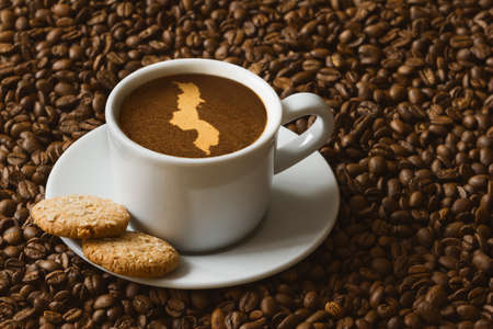 Still life photography of hot coffee beverage with map of Malawiの写真素材