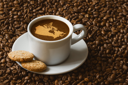 Still life photography of hot coffee beverage with map of Canadaの写真素材