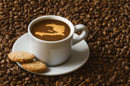 Still life photography of hot coffee beverage with map of Haitiの写真素材
