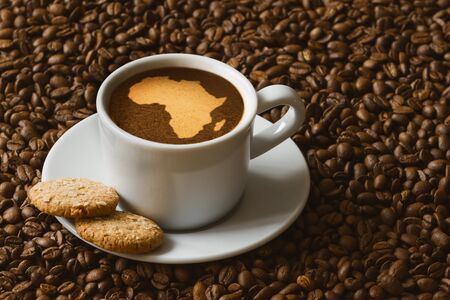 Still life photography of hot coffee beverage with map of Africaの写真素材