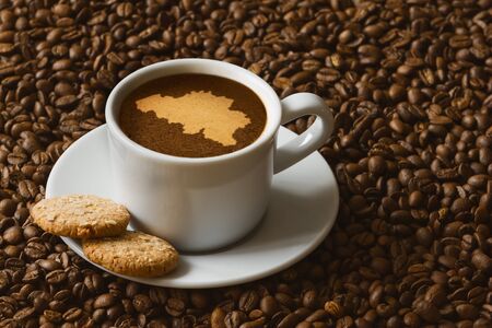 Still life photography of hot coffee beverage with map of  Belgiumの写真素材
