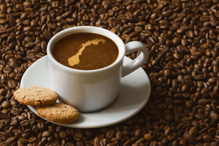 Still life photography of hot coffee beverage with map of Norwayの写真素材