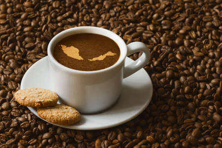 Still life photography of hot coffee beverage with map of Malaysiaの写真素材