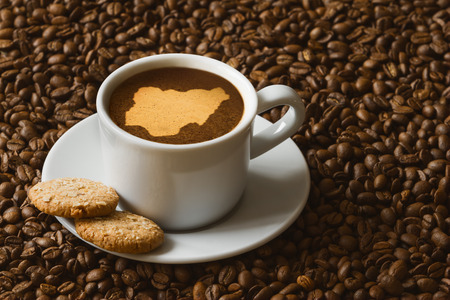 Still life photography of hot coffee beverage with map of Nigeriaの写真素材