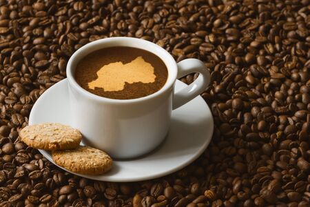 Still life photography of hot coffee beverage with map of Rwandaの写真素材
