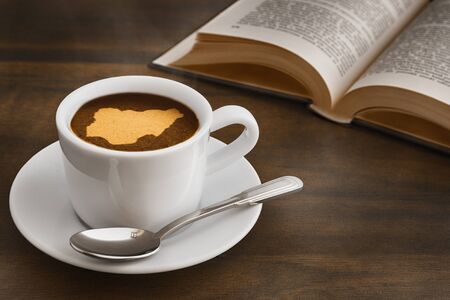 Still life photography of hot coffee beverage with map of Nigeriaの写真素材
