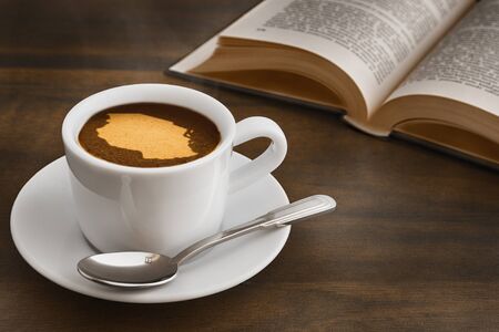 Still life photography of hot coffee beverage with map of Tanzaniaの写真素材