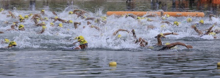 CAMARINES SUR- Aug. 14: Participants of Cobra Energy Drink Ironman 70.3 Philippines at the starting line in the swimming race event in Camarines Sur, Philippines on Sunday August 14, 2011.のeditorial素材
