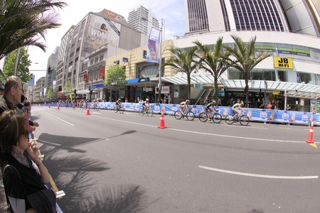 AUCKLAND, New Zealand- Oct. 20,2012: Women participants in the ITU World Triathlon Grand Finale Series cycle the main street of downtown Auckland.のeditorial素材