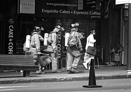 AUCKLAND-SEP. 15: Firemen and Firefighters walking in the streets of Auckland taken on September 15, 2009 in Auckland, New Zealand.のeditorial素材