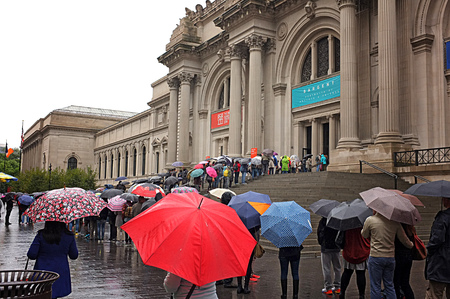 NEW YORK, OCT. 3: Tourist with umbrellas line up at the Metropolitan Museum of Art, colloquially the...