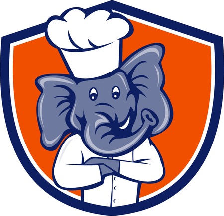 Illustration of a chef elephant wearing chef's hat with arms crossed viewed from front set inside shield crest on isolated background done in cartoon style.のイラスト素材