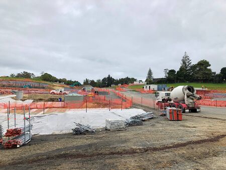 AUCKLAND, FEB.19: Building construction in the process of adding structure to real property or...