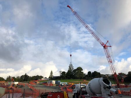 AUCKLAND, FEB. 28: Building construction in the process of adding structure to real property or...