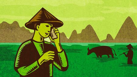 Retro style illustration of a Vietnamese or South East Asian farmer wearing a hat talking on mobile phone or cellphone with paddy field and mountains in background.の写真素材