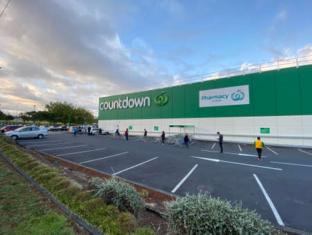 AUCKLAND-Apr. 3: Shoppers at Countdown Supermarket practice social distancing while queuing to enter...