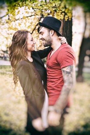Happy young couple in the park Valentine's Dayの写真素材