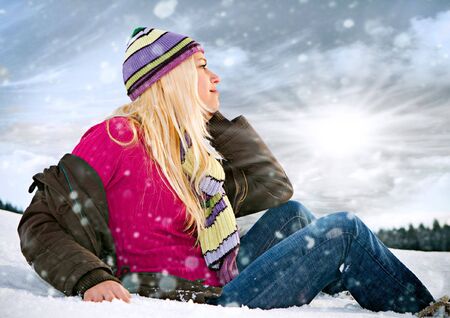 young blond girl in the snow