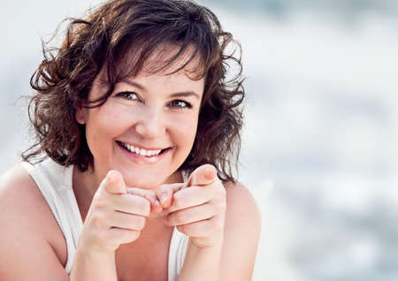 girl pointing with her fingersの写真素材