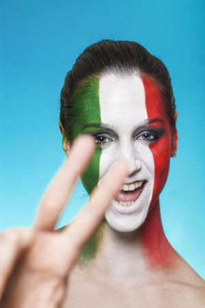Beautiful and cheerful italian supporter の写真素材