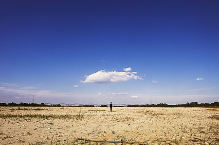Girl alone in a beautiful landscapeの写真素材