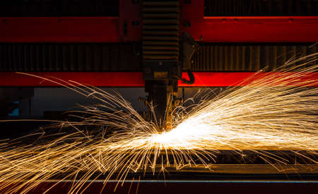 Industrial Laser cutting processing manufacture technology of flat sheet metal steel material with sparksの写真素材