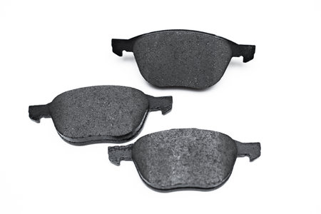 Set of brake pad, maintenance spares for car isolated on whiteの写真素材