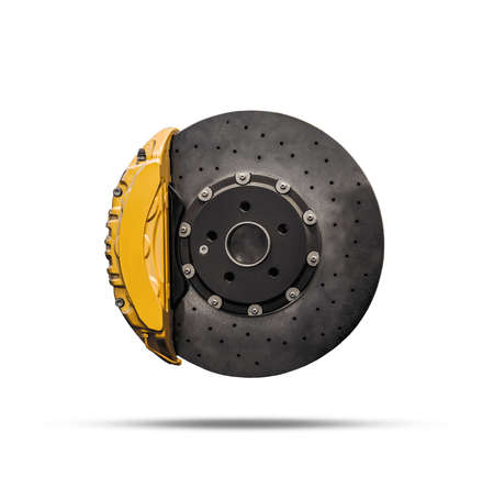 Ceramic disc brake with yellow caliper isolated on a white backgroundの写真素材