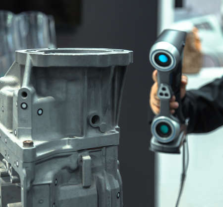 Engineer scans the part with 3D scanner. Technology scanning