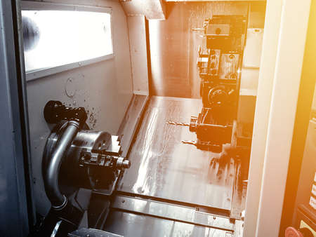CNC lathe machine or Turning machine drilling the steel rod .Hi technology manufacturing process.の写真素材