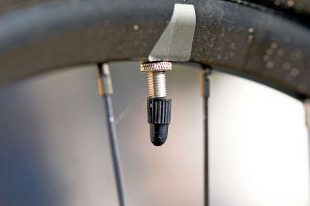 bicycle valve after a ride in the fieldの写真素材