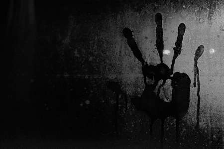 Handprint on a wet glassの写真素材