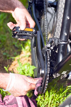 Bike service. A man repairing his bike
